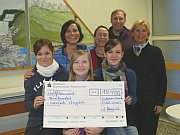 Students with a cheque